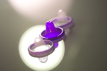 Rubber latex condom male contraceptive for safe disease and pregnancy free sex.の写真素材