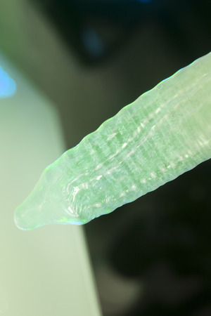Rubber latex condom male contraceptive for safe disease and pregnancy free sex.の写真素材
