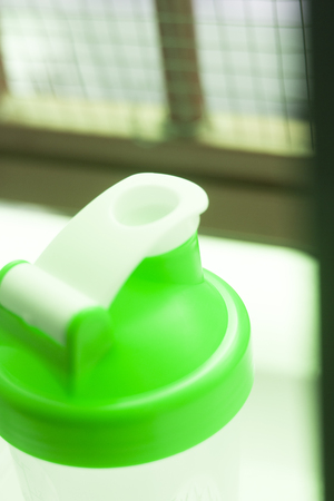 Whey protein shake shaker beaker for mixing post workout drinks in the gym for fitness and bodybuilding.の写真素材