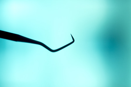 Dentist's dental toothpick tool instrumentation equipment to clean teeth and plaque.の写真素材