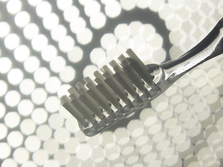 Dental teeth cleaning toothbrush isolated on lights background.の写真素材