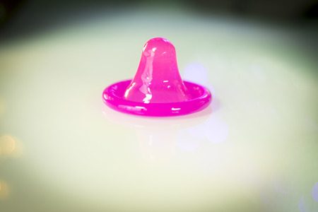 Rubber latex condom male contraceptive for safe disease and pregnancy free sex.の写真素材