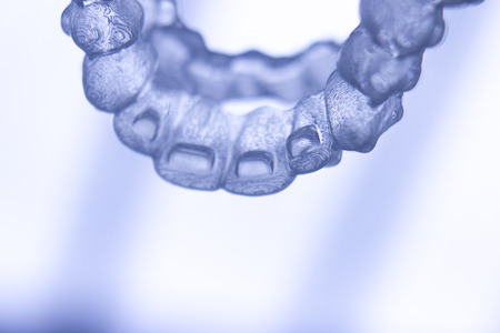 Invisible teeth retainers orthodontic brackets. Plastic modern straighterners to correct tooth...