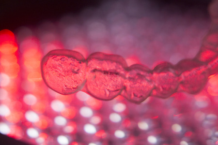 Invisible teeth retainers orthodontic brackets. Plastic modern straighterners to correct tooth alignment.の写真素材