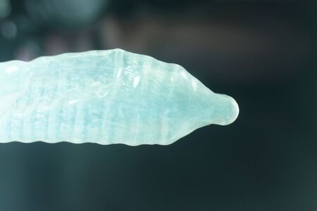 Rubber latex condom male contraceptive for safe disease and pregnancy free sex.の写真素材