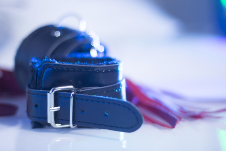 Bondage sadomasochism sex games erotic handcuffs and leather bdsm dominance whip.の写真素材