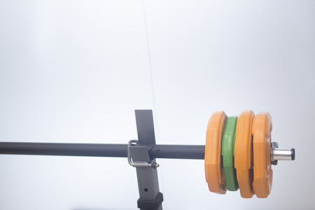 Barbell weights training bench in physiotherapy medical fitness center gym.の写真素材