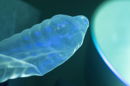 Rubber latex condom male contraceptive for safe disease and pregnancy free sex.の写真素材