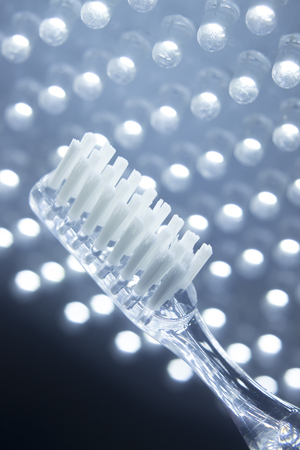 Dental teeth cleaning toothbrush isolated on lights background.の写真素材