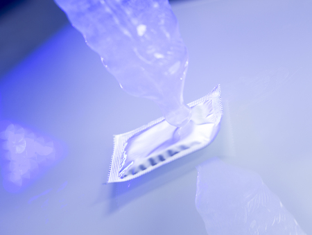 Rubber latex condom male contraceptive for safe disease and pregnancy free sex.の写真素材