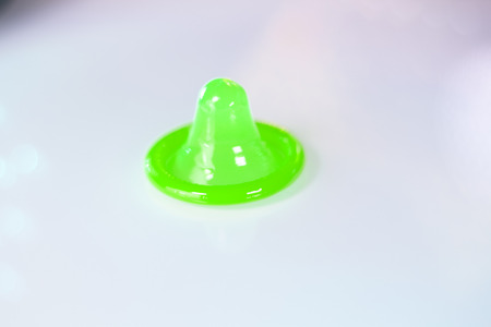 Rubber latex condom male contraceptive for safe disease and pregnancy free sex.の写真素材