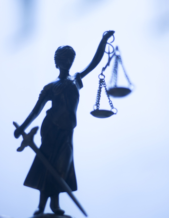 Legal law firm bronze statue of the goddess themis with scales of justice in attorneys office.の写真素材