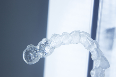 Invisible dental aligners plastic straighteners orthodontic brackets to align and straighten teeth.
