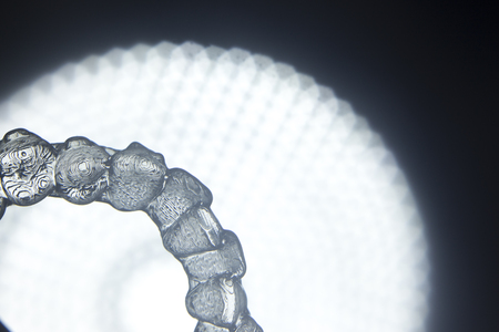 Invisible teeth retainers orthodontic brackets. Plastic modern straighterners to correct tooth...