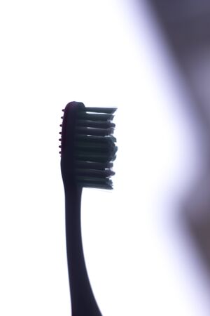 Manual modern tooth brush closeup on plain background.の写真素材