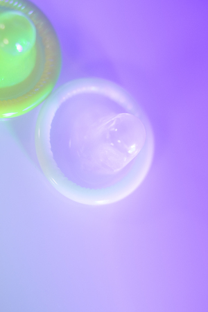 Rubber latex condom male contraceptive for safe disease and pregnancy free sex.の写真素材