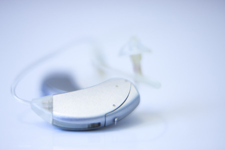 Modern digital in the ear hearing aid for deafness and the hard of hearing patients.の写真素材