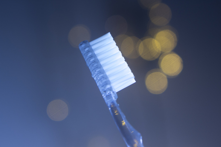 Dental toothbrush closeup isolated on abstract backgroundの写真素材