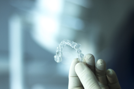 Invisible teeth retainers orthodontic brackets. Plastic modern straighterners to correct tooth...