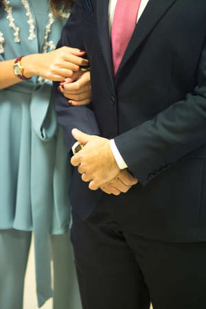 Young bride and groom in  formal weddings business suit and casual dress in civil wedding marriage ceremony.の写真素材