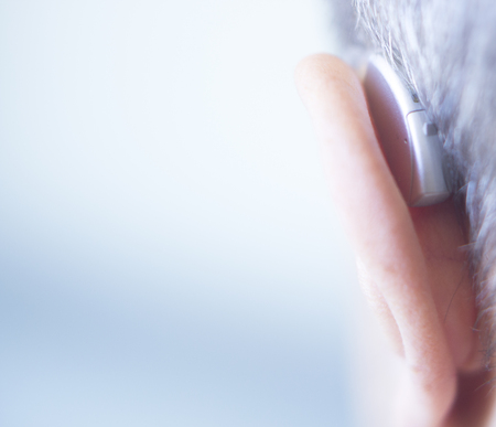 Modern digital in the ear hearing aid for deafness and the hard of hearing patients.の写真素材
