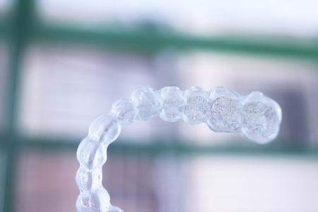 Invisible teeth dental tooth retainer aligner to straighten each tooth in orthodontics treatment for patients.の写真素材