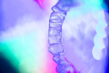 Invisible teeth retainers orthodontic brackets. Plastic modern straighterners to correct tooth alignment.の写真素材