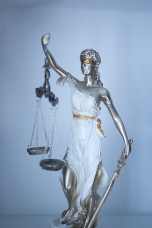 Lawyers legal blind justice bronze statue Themis and scales in attorneys law firm offices.の写真素材