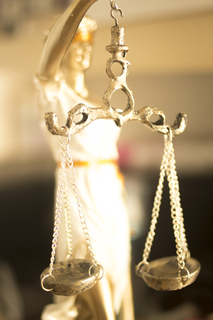 Lawyers legal blind justice bronze statue Themis and scales in attorneys law firm offices.の写真素材