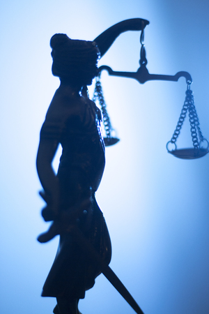 Legal law firm bronze statue of the goddess themis with scales of justice in attorneys office.の写真素材