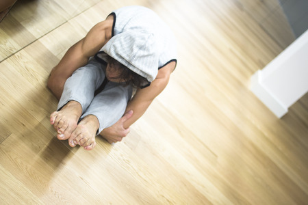 Man dancer dance  teacher stetching in gym fitness studio doing advanced bar stretch flexibility posture.の写真素材
