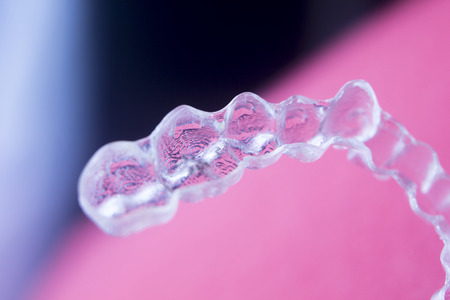 Invisible dental aligners plastic straighteners orthodontic brackets to align and straighten teeth.の写真素材