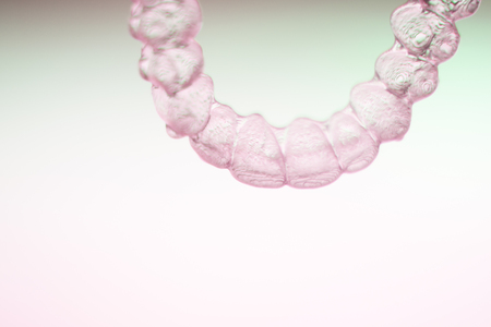 Invisible teeth dental tooth retainer aligner to straighten each tooth in orthodontics treatment for patients.の写真素材