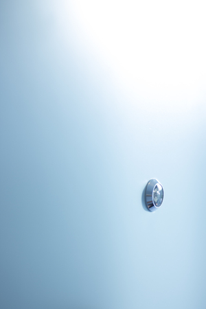 Spyhole peephole hotel bedroom door in luxury five star hotel bedroom door security entry.の写真素材