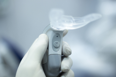 Dental bracket aligner accelerator vibrator for orthodontic straighteners, brackets and aligners.の写真素材