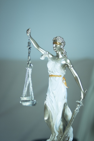 Lawyers legal blind justice bronze statue Themis and scales in attorneys law firm offices.の写真素材