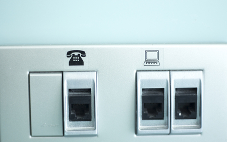 Luxury five star hotel bedroom bwall sockets for electricity, telephone, internet wifi services.の写真素材