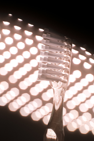 Dental teeth cleaning toothbrush isolated on lights background.の写真素材