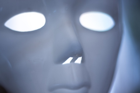 Horror terror scary mask with empty eyes and terifying ghostly stare.の写真素材