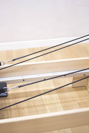 Reformer pilates studio machine for fitness workouts in gym.の写真素材