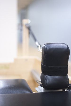 Reformer pilates studio machine for fitness workouts in gym.の写真素材