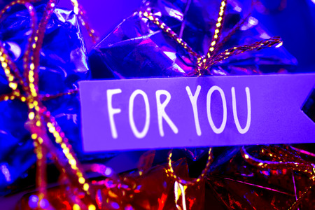 Christmas party celebration presents gift wrapped miniatures For You tag.の写真素材