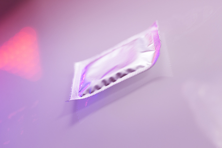 Rubber latex condom male contraceptive for safe disease and pregnancy free sex.の写真素材