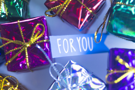 Christmas party celebration presents gift wrapped miniatures For You tag.の写真素材