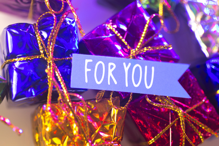 Christmas party celebration presents gift wrapped miniatures For You tag.の写真素材