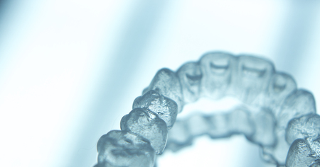 Invisible teeth retainers orthodontic brackets. Plastic modern straighterners to correct tooth...