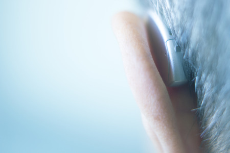 Modern digital in the ear hearing aid for deafness and the hard of hearing patients.の写真素材