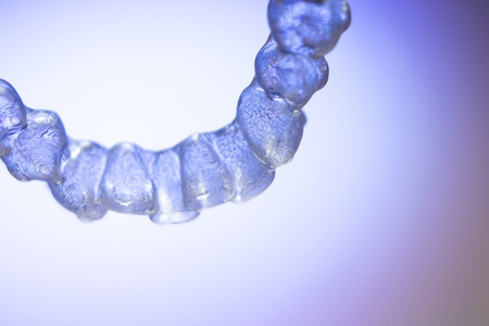 Invisible teeth retainers orthodontic brackets. Plastic modern straighterners to correct tooth...
