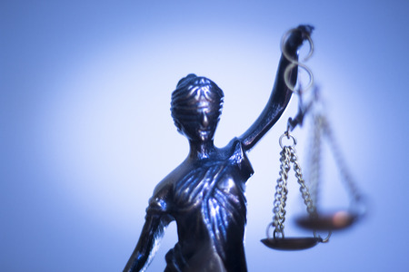 Legal law firm bronze statue of the goddess themis with scales of justice in attorneys office.の写真素材