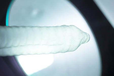 Rubber latex condom male contraceptive for safe disease and pregnancy free sex.の写真素材